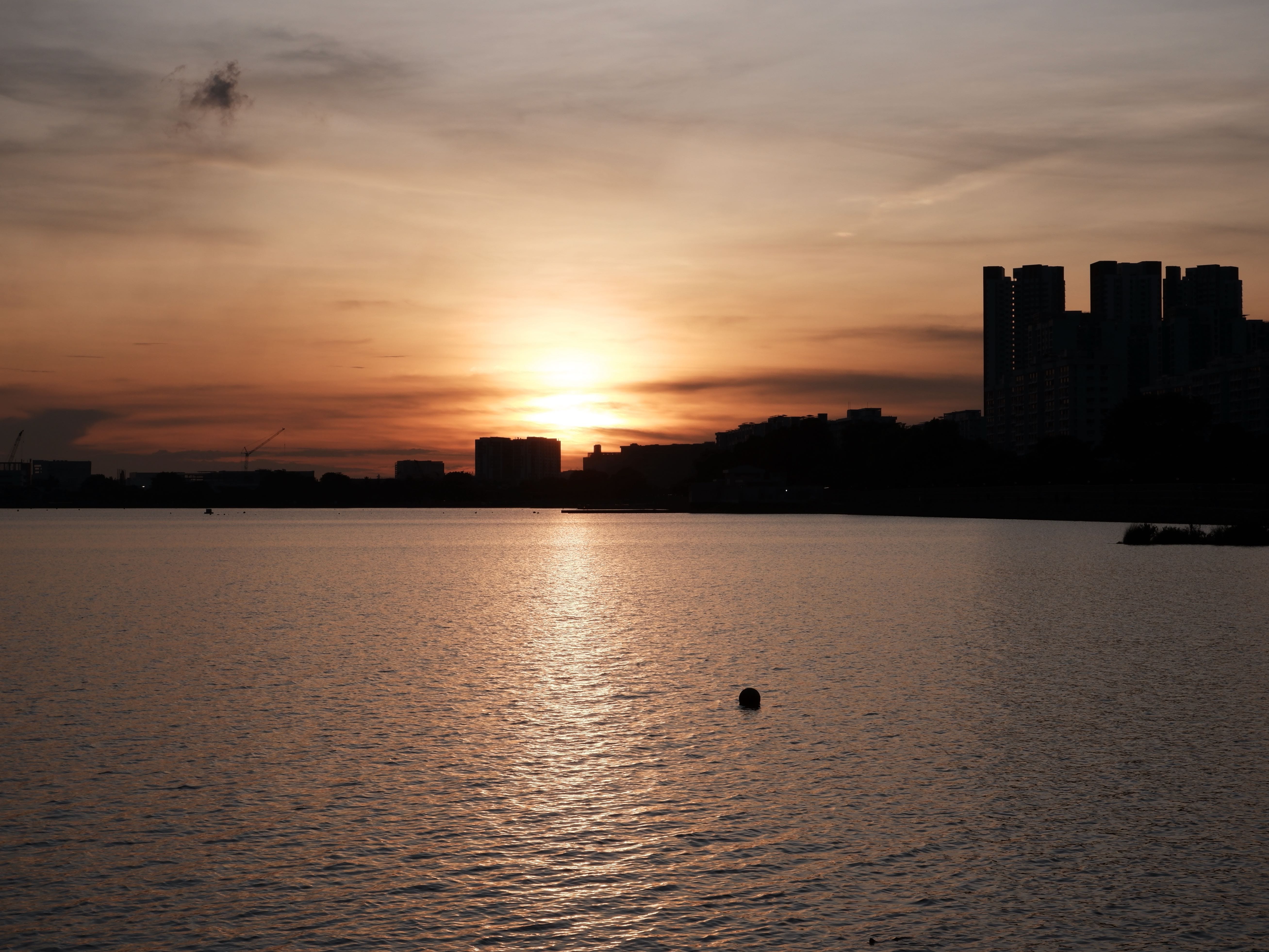 Featured image for Sunset at Pandan Reservoir - A golden hour photo walk around Pandan Reservoir, one of Singapore's quieter hidden gems with open skies, calm waters, and stunning sunset views.