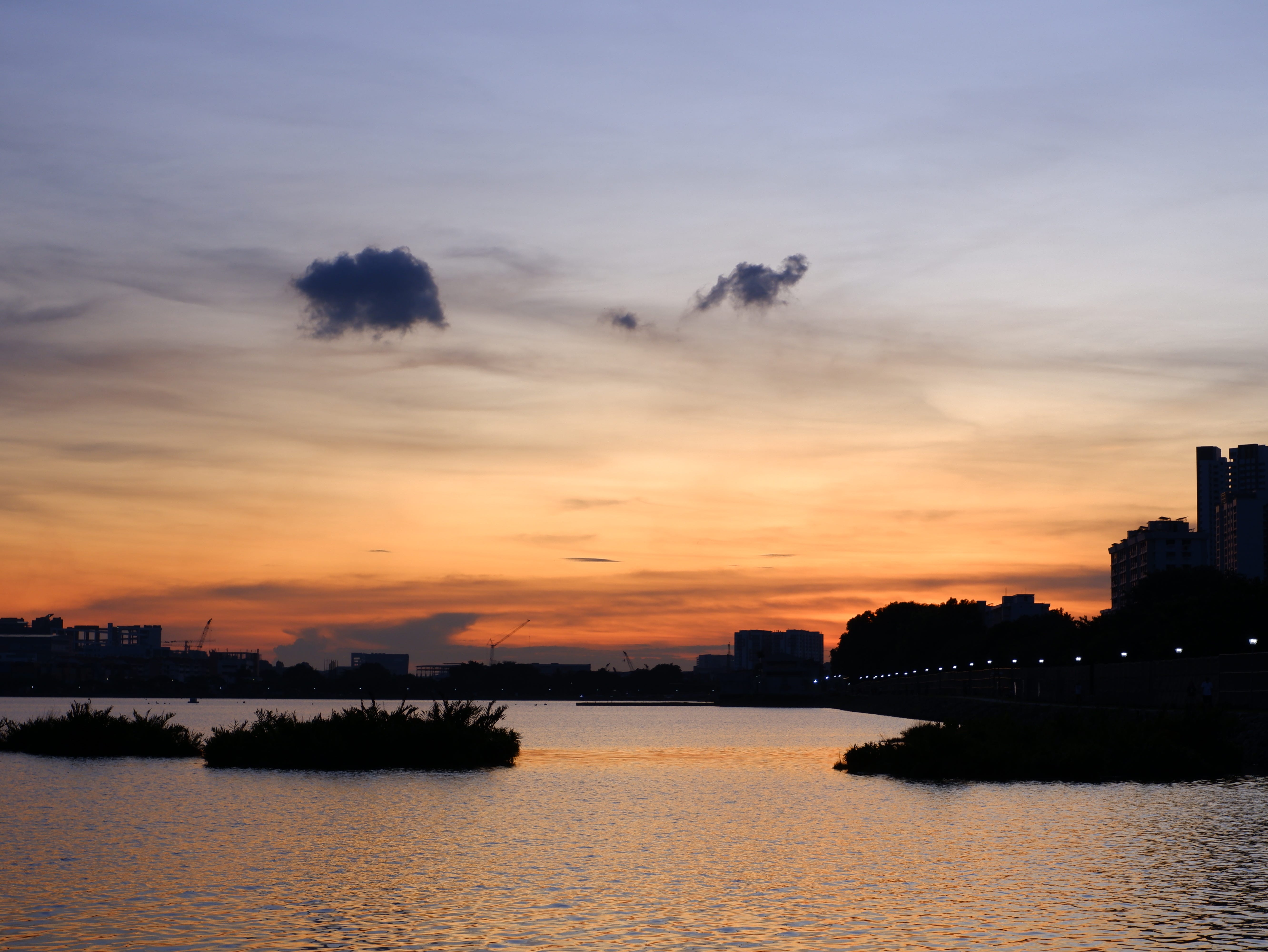 The sun sets, leaving behind a beautiful orange glow on the horizon.