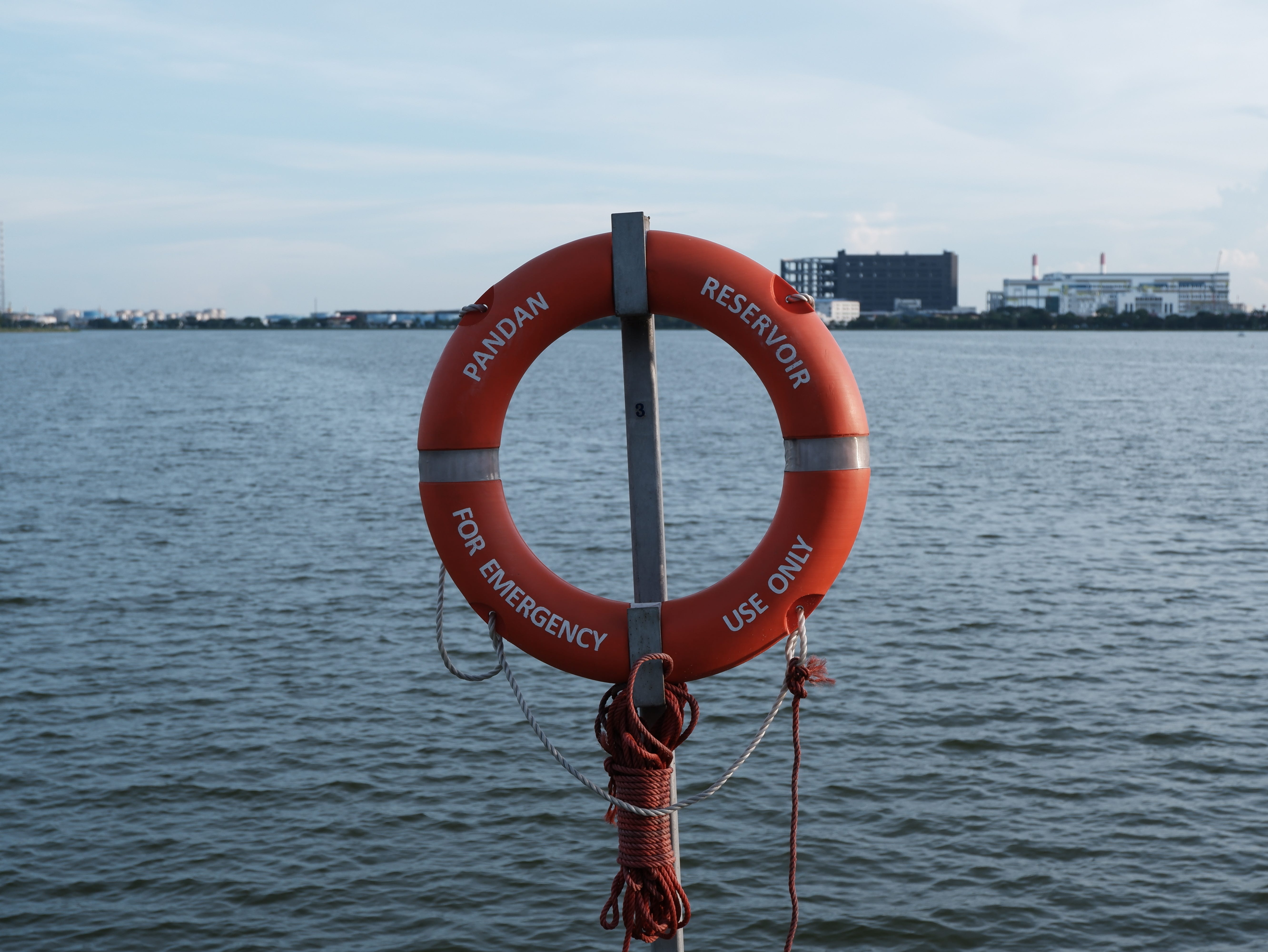 Lifebuoys like these are installed along the edge of the water.