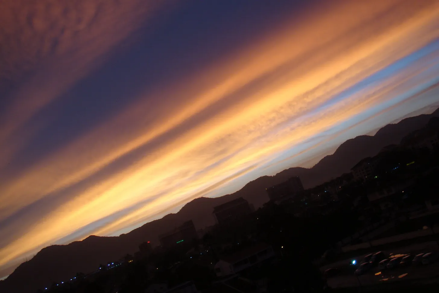 A serene sky above distant mountains.
